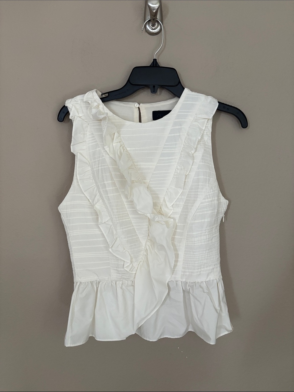 Sleeveless White Ruffle Peplum Top